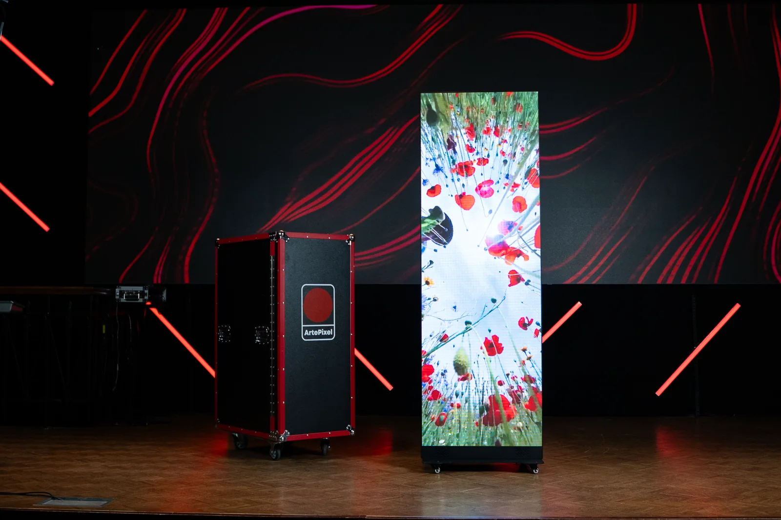 ArtePixel NEXA LED poster displaying bright floral content on stage