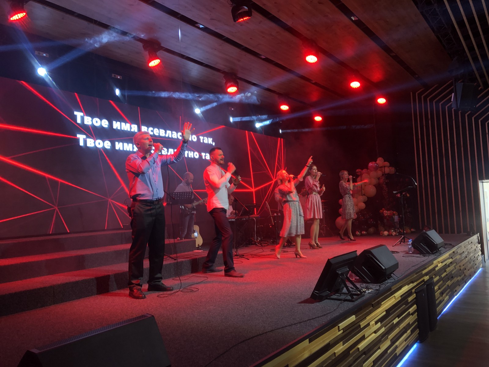 Side view of the wide Church of Grace stage beneath the lowered ceiling