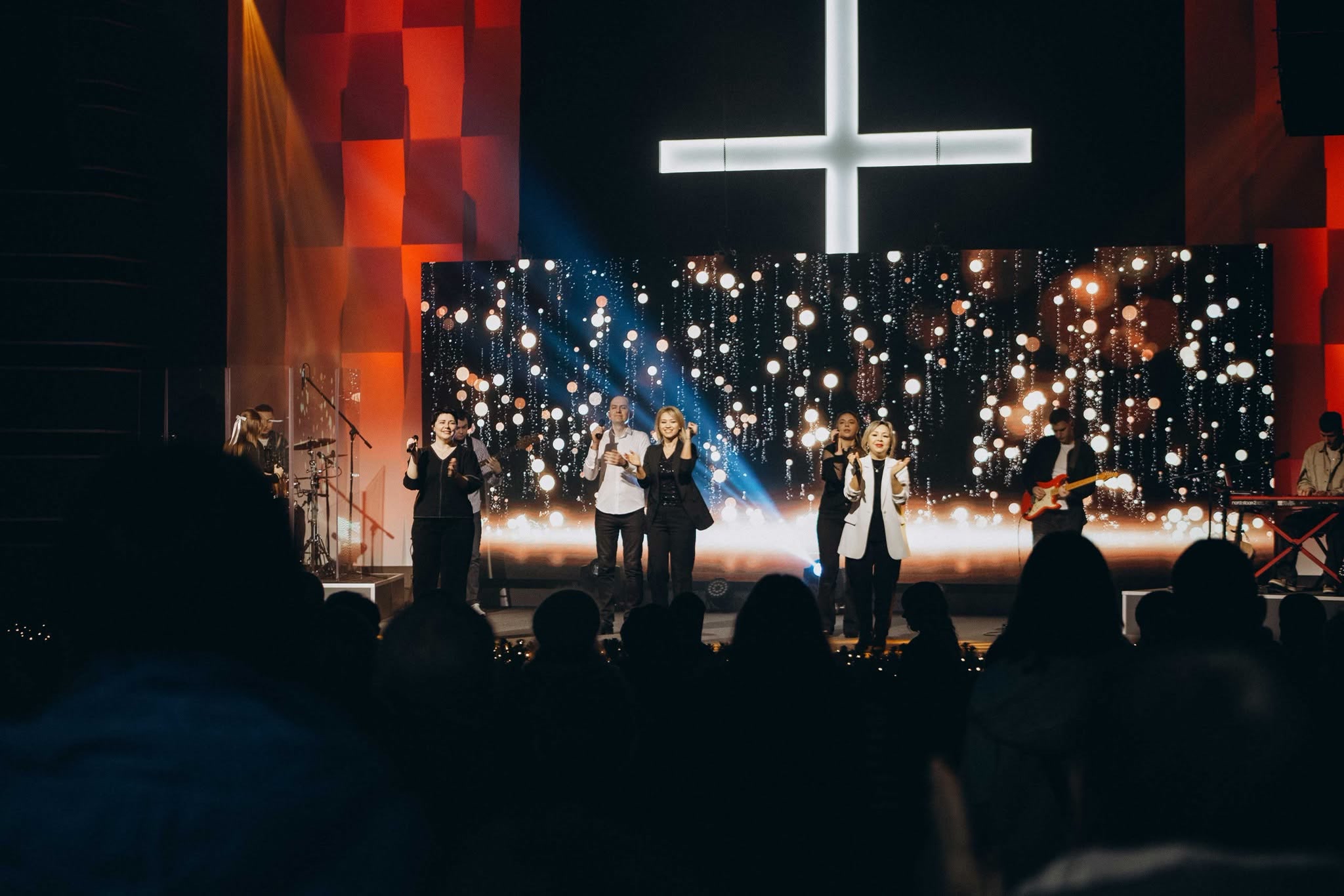 Worship team performing in front of the combined Svitlo Svitu LED display